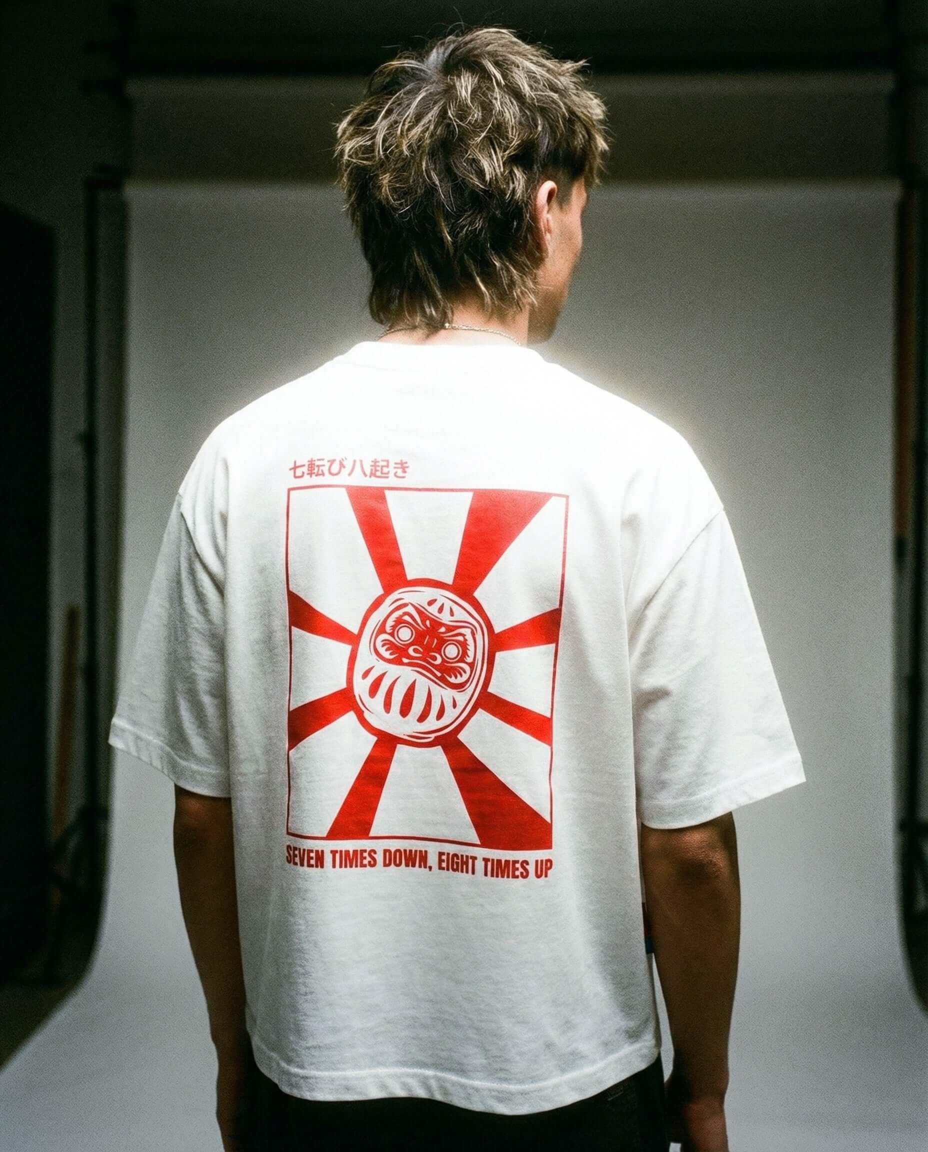 Daruma - White Cropped Oversized Tee - Model wearing tee with Daruma graphic and red sun design on the back.