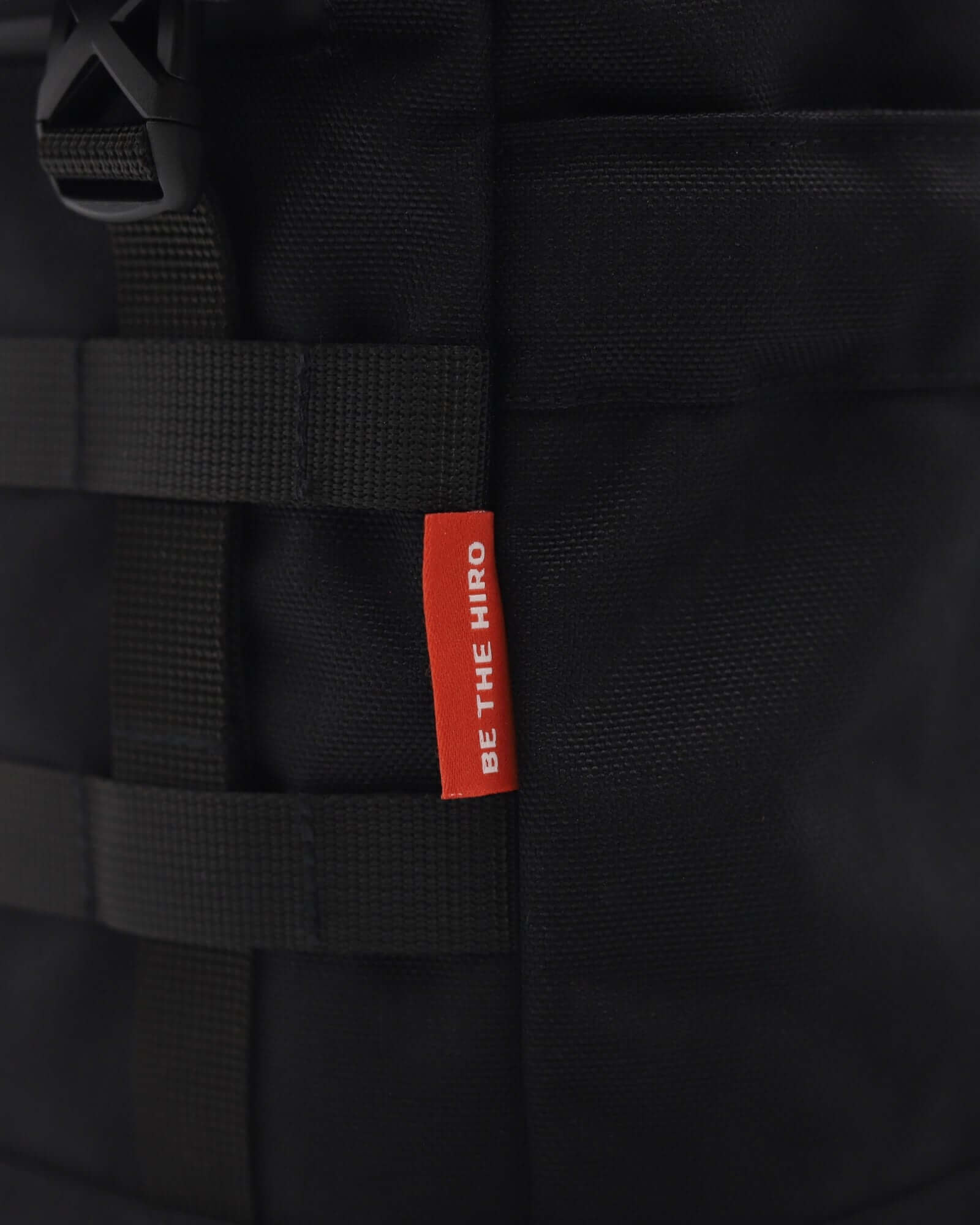 Minato Lite 2.0 - Dark Black close-up showcasing durable CORDURA® fabric and 'BE THE HERO' tag.