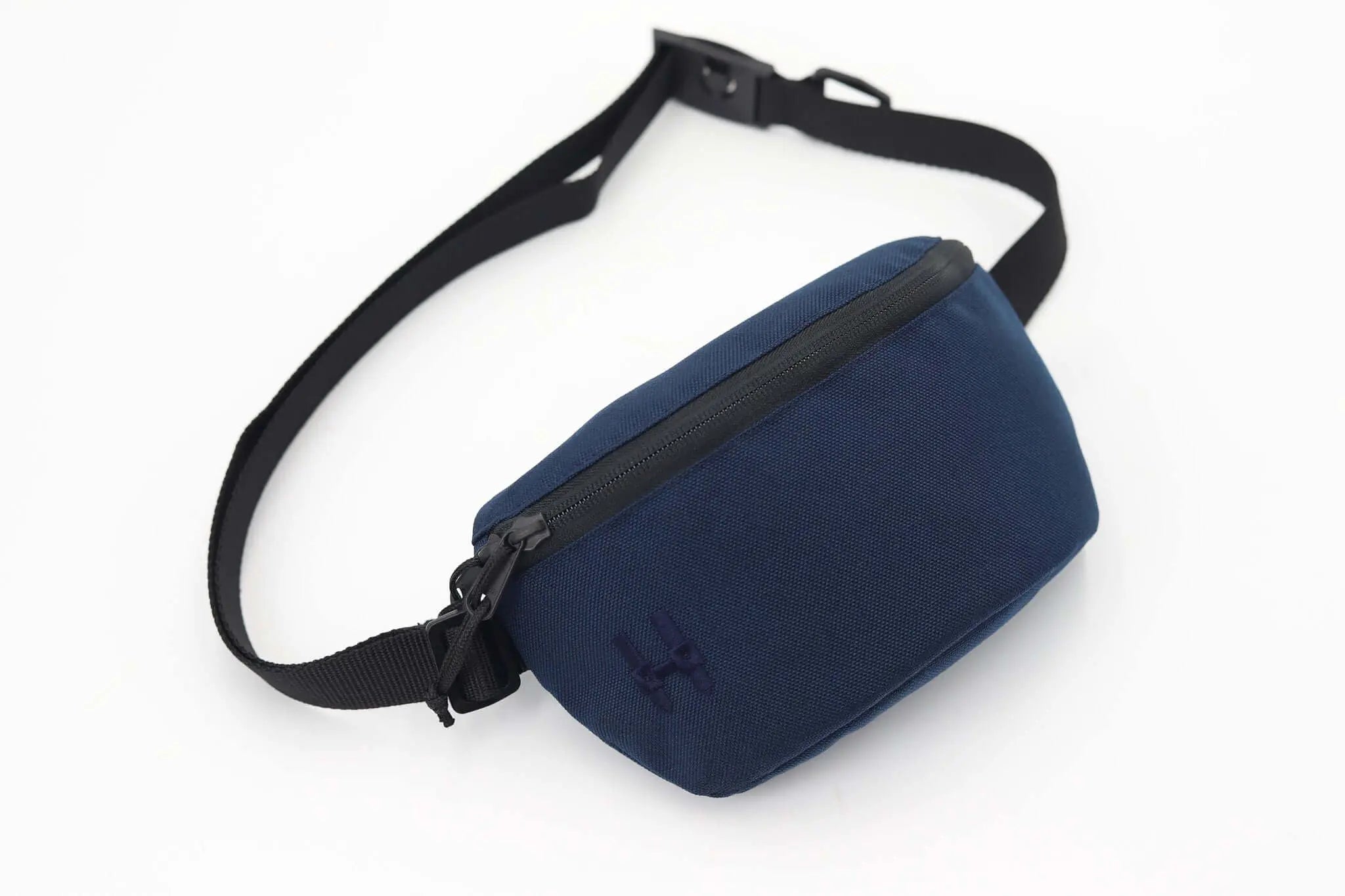 Sora 2.0 - Navy Blue minimalist waist bag with adjustable strap and modern design.