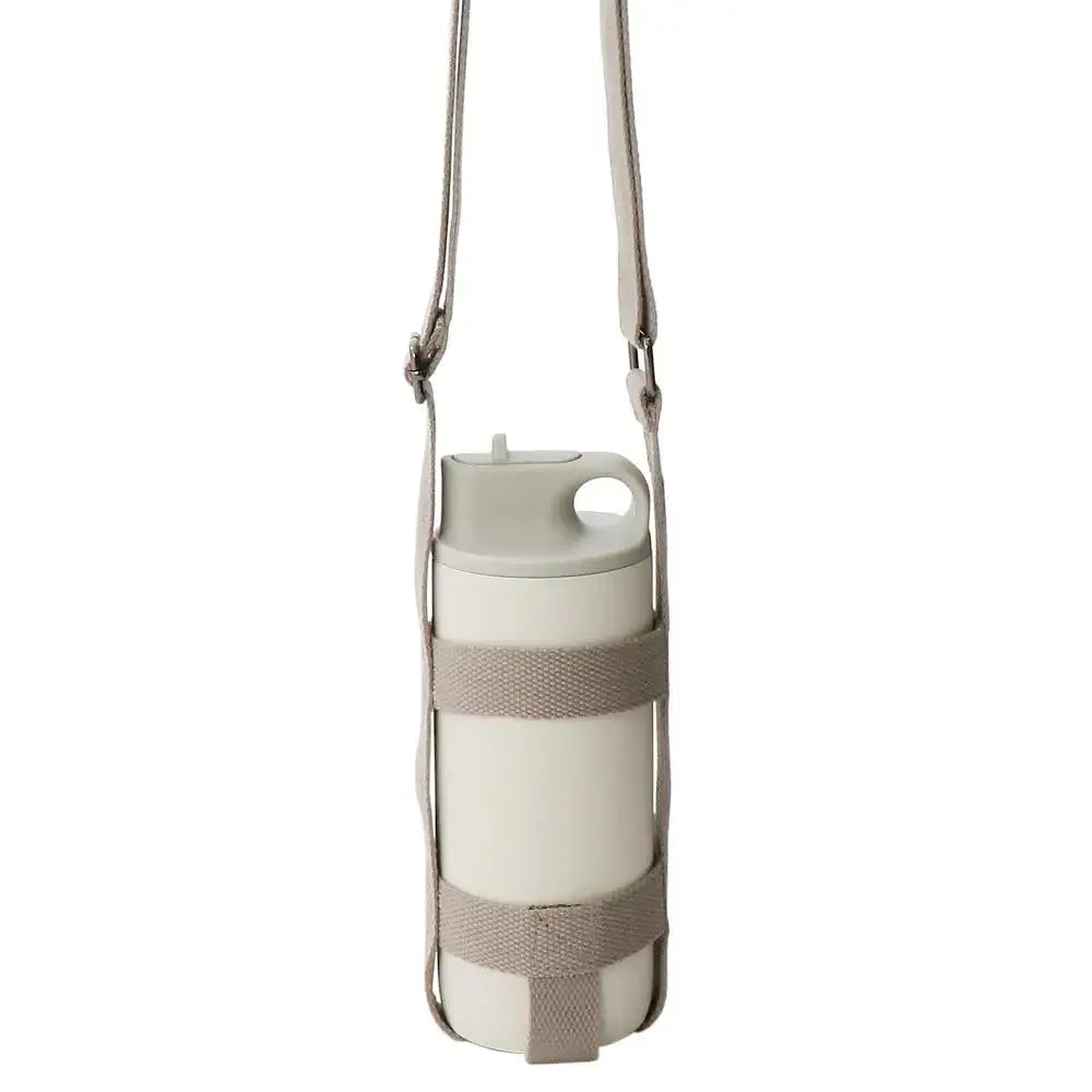 Adjustable beige TUMBLER strap for KINTO cups, perfect for outdoor activities and walks.